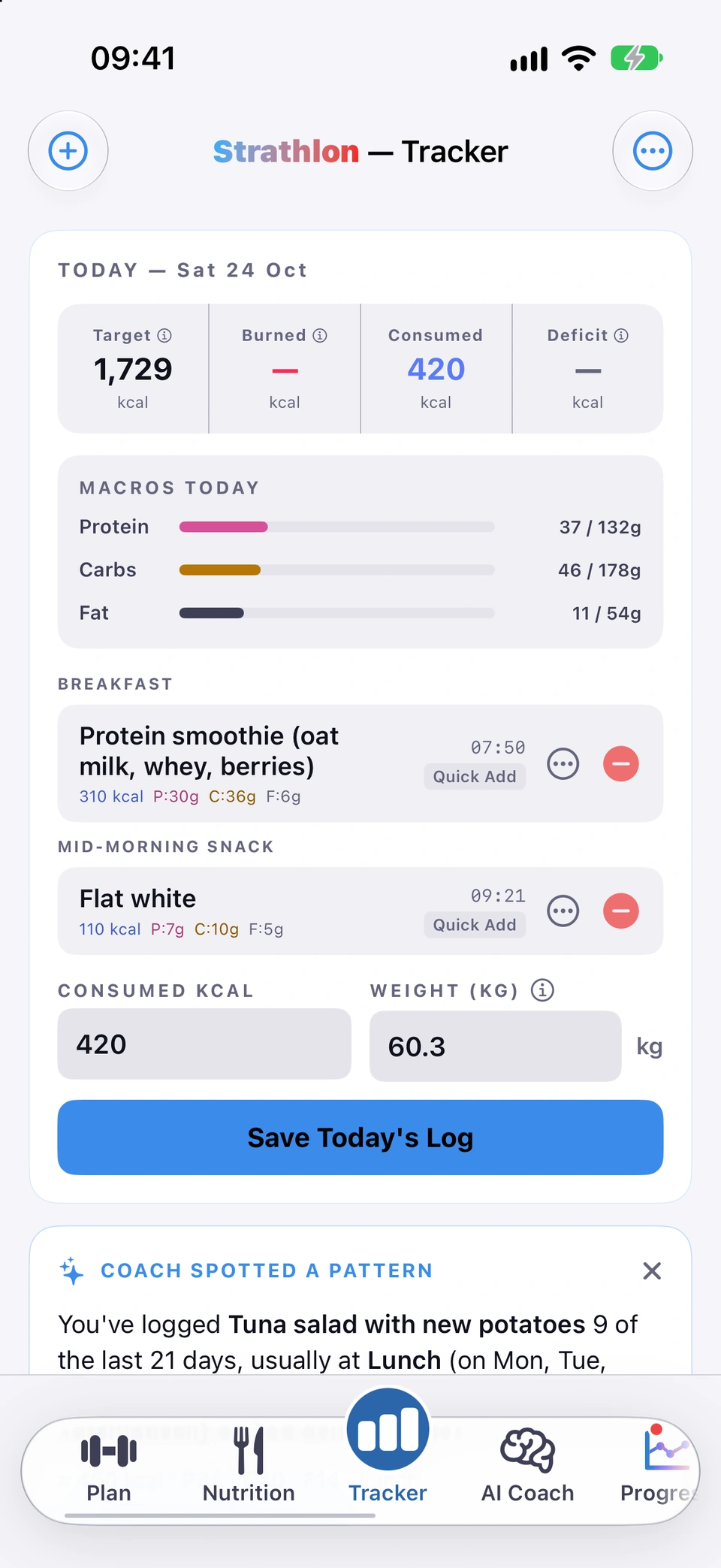 Strathlon Tracker, today, Saturday 24 October, scrolled from top to bottom: Target 1,729 kcal, Consumed 420 kcal; Macros today with protein 37 of 132 g, carbs 46 of 178 g, fat 11 of 54 g; Breakfast, a protein smoothie, 310 kcal, and Mid-Morning Snack, a flat white, 110 kcal; Save Today’s Log; a Coach spotted a pattern card; Quick Add; and the days list.